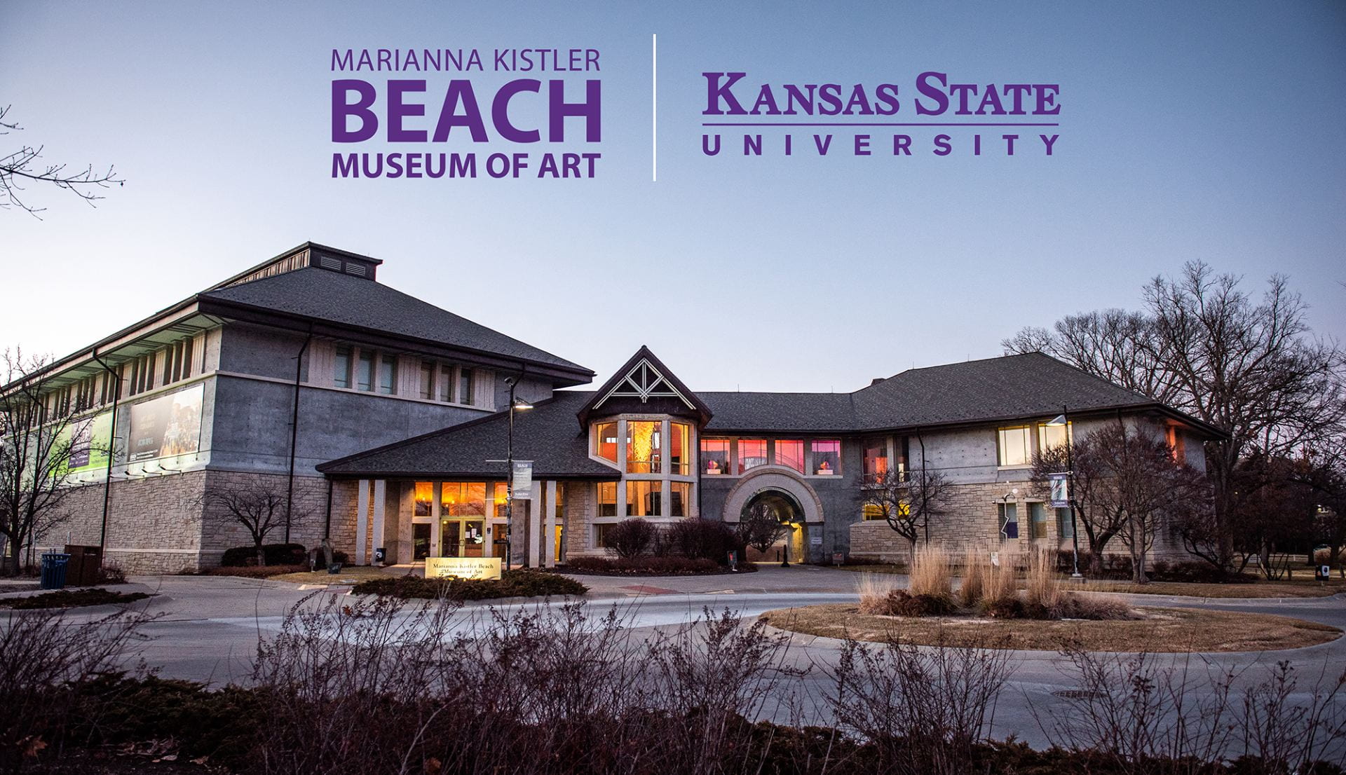 Beach Museum of Art exterior photo with the exhibition "Inside Out" featuring artworks from the museum's collection in colorfully lighted windows.