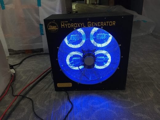 A large box with a circle at its center is lit by four smaller glowing blue lights inside. 