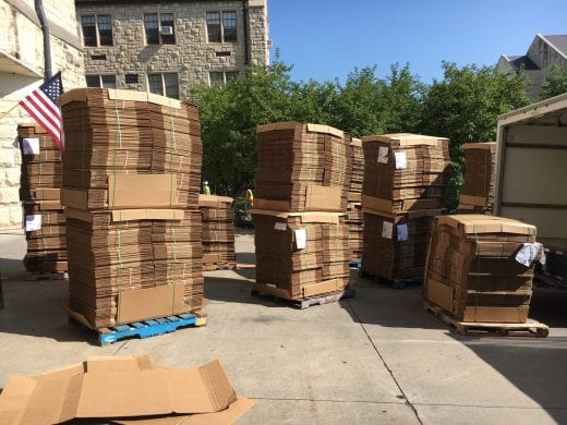 Boxes on pallets arrive at Hale Library